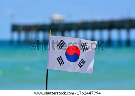 Beautiful National Flag of South Korea on Tropical Beach