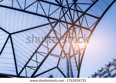 Structure of steel roof frame for building construction on sky b