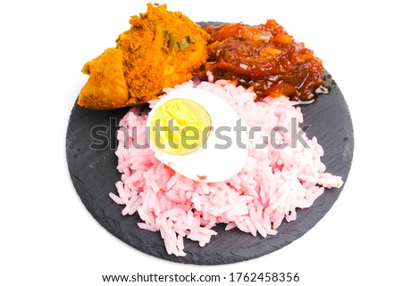 A picture of new recipe in Malaysia called "nasi lemak" strawberry on white  background. Fragrance coconut milk rice with spicy sauce and coconut chicken.