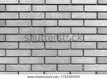 A neatly laid out brick wall. Brickwork.