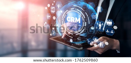 CRM Customer Relationship Management for business sales marketing system concept presented in futuristic graphic interface of service application to support CRM database analysis. Royalty-Free Stock Photo #1762509860