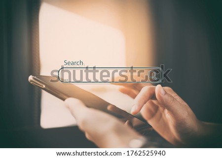 Close up woman hand hold using smart phone with search bar icon at coffee shop background. Copy space of technology business and travel holiday concept. Vintage tone filter effect color style. Royalty-Free Stock Photo #1762525940