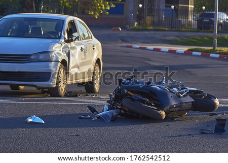 a motobike crashed into a car a motorcyclist was injured police investigation fingerprint investigator Royalty-Free Stock Photo #1762542512