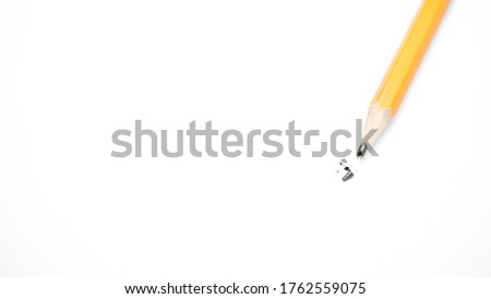 broken pencils are lying on a white background