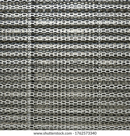 Metal mesh, grill. Hexagonal holes. Aluminum grill.