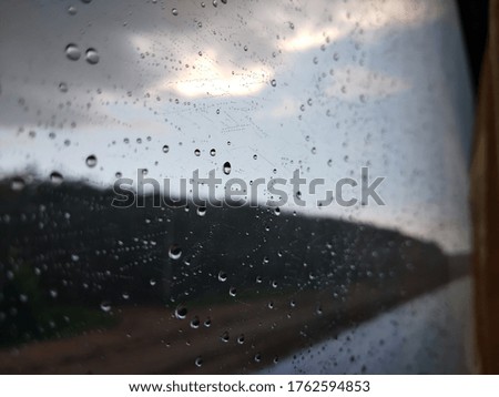 Rain outside the window become a bright sky.