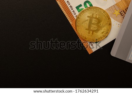 Cash, credit, deposits, foreign exchange transactions, money transfers. Euro notes, bitcoins, card with copy-space on a black background. All payment methods