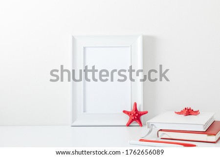 White frame mockup in interior with sea elements on white wall background. Template frame for text. Poster mockup.