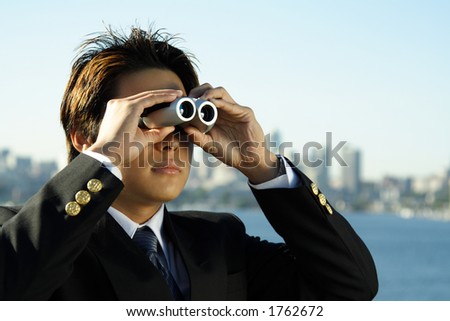 Businessman with binoculars, can be used for business vision/prospect metaphor