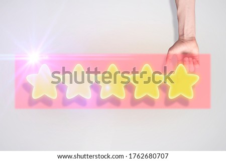 finger hand gives the five star raiting, user satisfaction concept