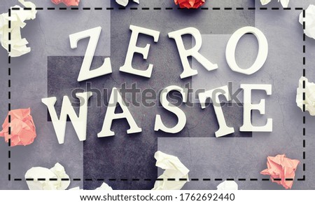 The concept of proper and environmental health. The inscription on a black background with wooden letters and paper elements. Free GMO. Zero waste.