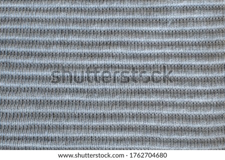 beautiful texture of grey knitted clothing