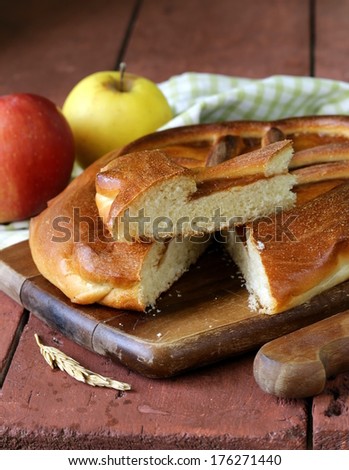 homemade apple pie on a wooden table rustic style