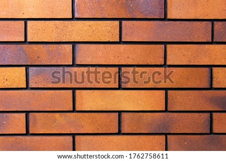 Arrange the bricks side by side - on a wall. The front of the brick wall photo