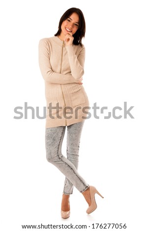 Beautiful young asian caucasian woman in sweater and jeans studio portrait isolated over white background