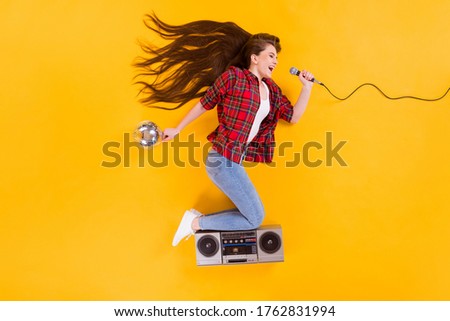 Top view above high angle flat lay flatlay lie concept of her she nice funky cheerful cheery girl singing pop hit having fun flying isolated on bright vivid shine vibrant yellow color background