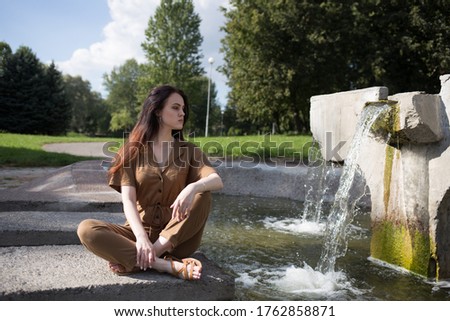 
Girl enjoys nature near the river
