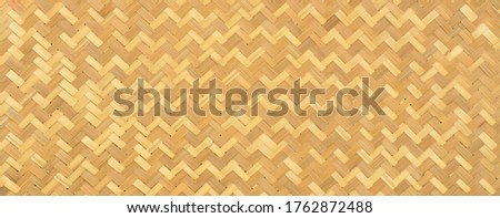 Panoramic of brown traditional handcraft weave Thai style pattern nature background texture wicker surface for furniture material