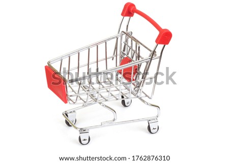 Empty shopping cart over white background