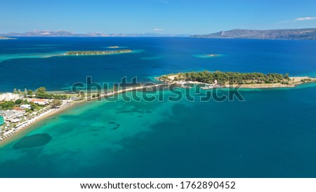 Aerial drone photo of famous island of dreams or Pezonisi connecting with small road with seaside fishing village of Eretria, Central Evia island, Greece