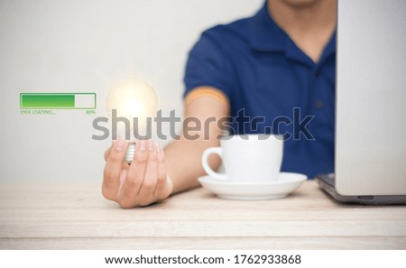 man holding light bulb on hand with idea loading progressive icon business concept