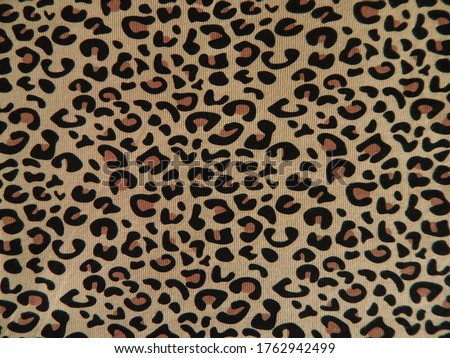 The leopard printed fabric background