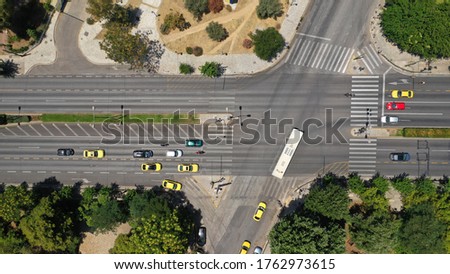 Aerial drone top down photo of Vasileos Konstantinou crossroad avenue with light traffic
