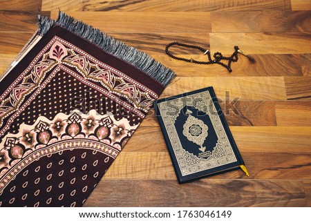 Ornamental black rosary, prayer mat Ramadan Kareem Greeting Card. Ramadan Mubarak. Translated: Happy & Holy Ramadan. Month of fasting for Muslims