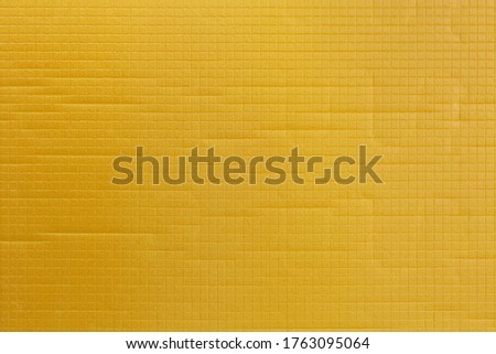 yellow soft sport or yoga foam mat surface flat texture and background