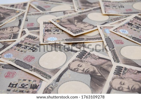 Randomly placed Japanese banknotes. Horizontal position.