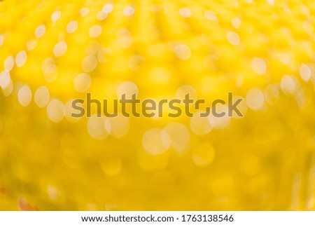 Abstract gold and yellow color bokeh blur background with copy space