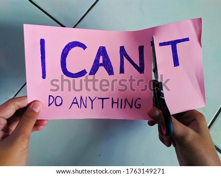 the words "I can't do anything" with the letter T cut out to be "I can do anything"