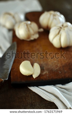 Fresh garlic on wooden table, selective focus
