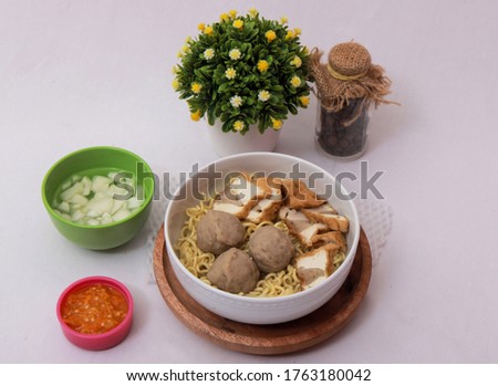 noodles with meatball and tofu topping