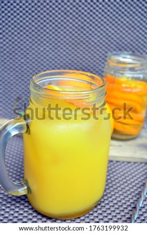 Fresh orange juice in the glass jar