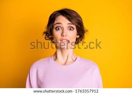 Close-up portrait of her she nice attractive lovely cute worried scared depressed girl biting lip waiting bad news isolated on bright vivid shine vibrant yellow color background Royalty-Free Stock Photo #1763357912