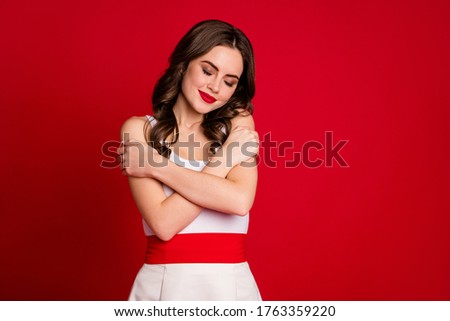 Photo of attractive charming lady hold herself hugging shoulders amazing soft pleasant skin eyes closed wear white dress skirt isolated bright red color background