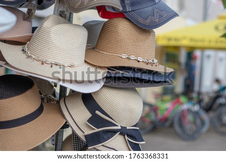 Straw hats for sale from street wendors in Croatia, symbols of summer, travel and warm temperature