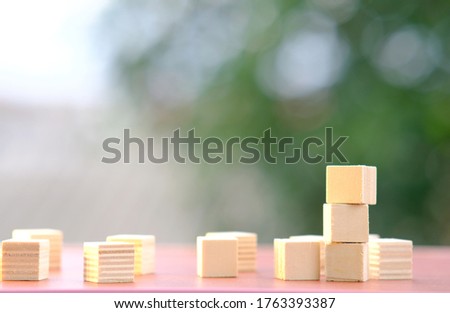Wooden cube for business icon and wood cube pattern background, business idea concept