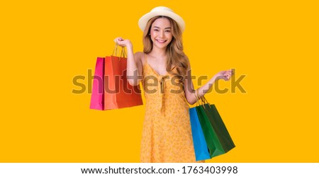 Asian woman shopping sessions at a discounted price. on Mid year sales or New Year sales the product price  the most discounted from 50% up to 80% 