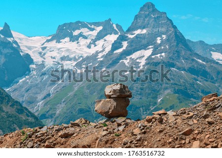 Balanced stones on the mountain background