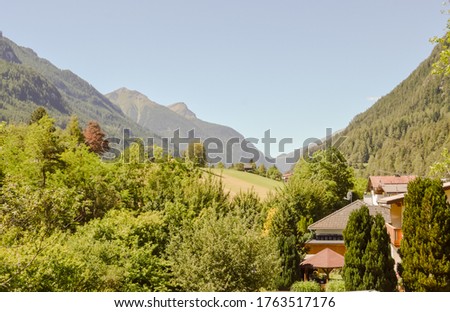 Austrian countryside and mountains under the sun