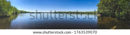 background photo panorama, view of a beautiful forest lake designed for fishing, in the midst of lush greenery, in the territory of a natural national park, in Mari El, Russia