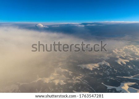 View from high above of the mountains and clouds