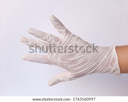 A hand wearing white glove. Isolated in white background. Space for text