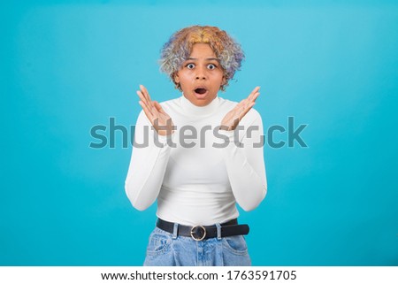 surprised afro american woman or girl isolated on background