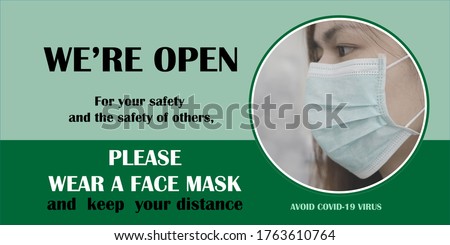 The blur woman wear face mask in the gray tone with the safety messages for wearing a face mask on foreground. Face covering required.  Safety sign and symbol during coronavirus. WE ARE OPEN sign.
