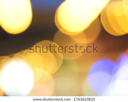 The picture of Yellow abstract background blur with bokeh lights.