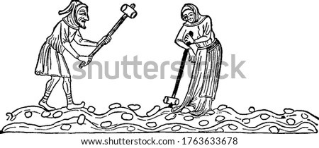 Two medieval peasants, a man and woman, break clods of earth apart with mallets. The man is swinging his mallet, while the woman appears to be resting on hers, vintage line drawing or engraving. Royalty-Free Stock Photo #1763633678