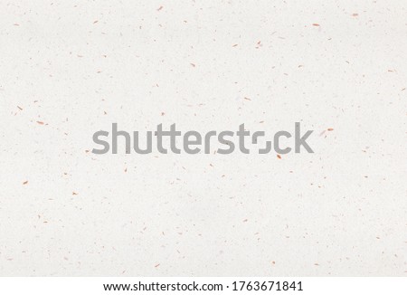 Sheet of recycled paper background with inclusions of golden particles. Extra large highly detailed image.